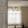 Petalii 10 lysekrone, poleret messing/hvid